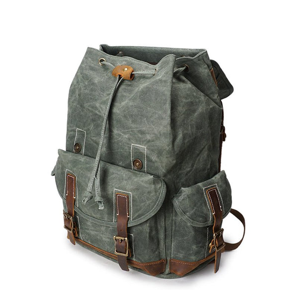 canvas and leather backpack gray 25L Traveler Kodiak The exterior features a leather flap secured by two straps Waxed Canvas Grey Canvas Backpack