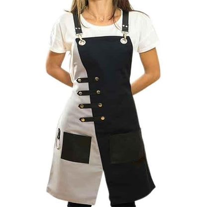 Woman wearing black and gray two - tone apron with leather straps and pockets, white background