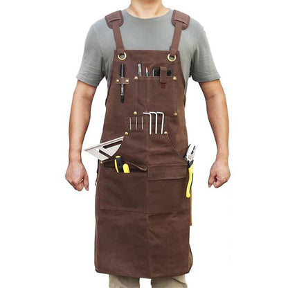 Man wearing brown heavy - duty work apron with multiple tool pockets, white background