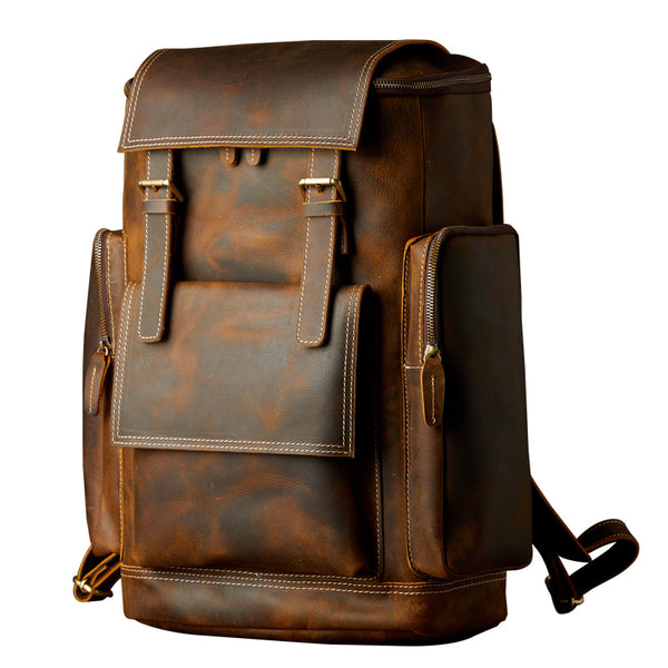 Front view of retro brown leather backpack on white background, full - grain leather, multi - pocket & buckle design