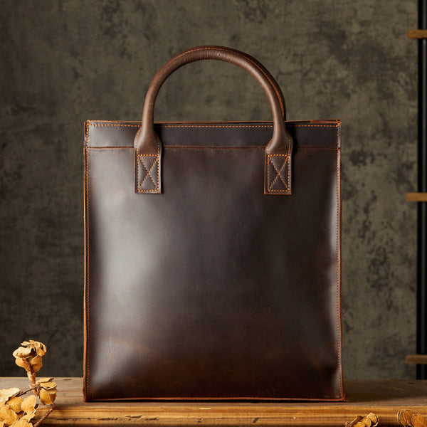 Dark brown leather handbag, double handles, minimalist design
