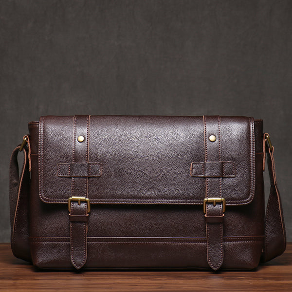 Dark brown leather messenger bag, front view with buckle closures, elegant design