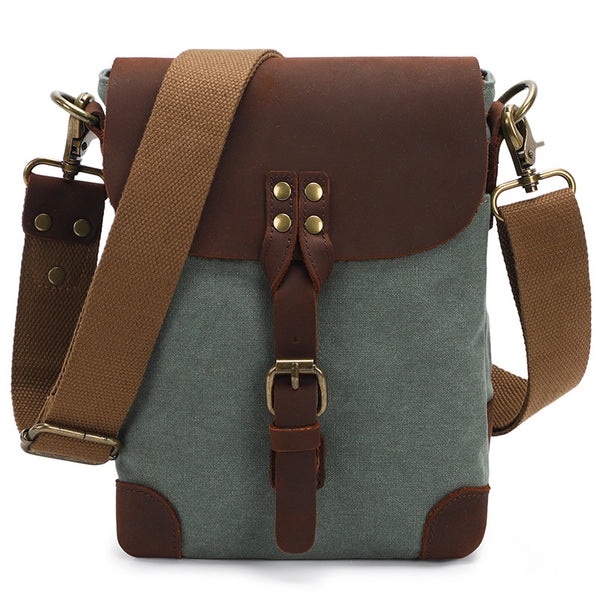 Green canvas crossbody bag with brown leather accents
